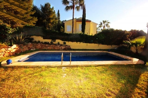 The paradise-like garden of the villa with spacious, well maintained pool