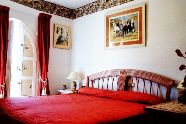 One of the exquisite bedrooms of the apartment with direct access to the balcony 