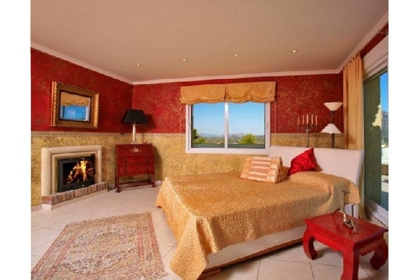 One of the exquisite bedrooms with open chimney for a romantic atmosphere